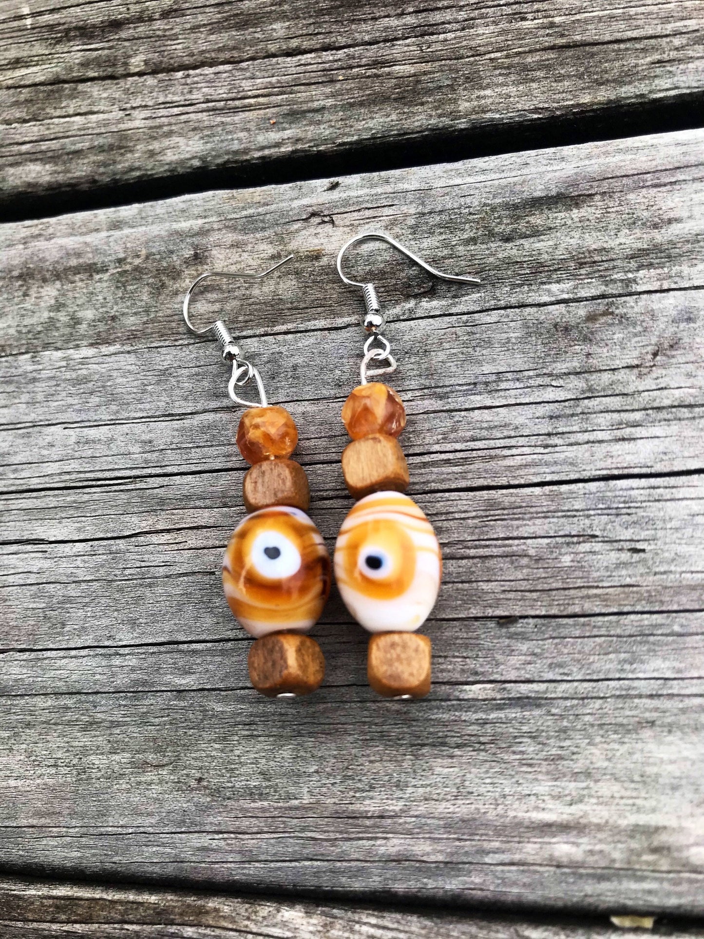 Trippy eye dangle earrings with glass and wood beads