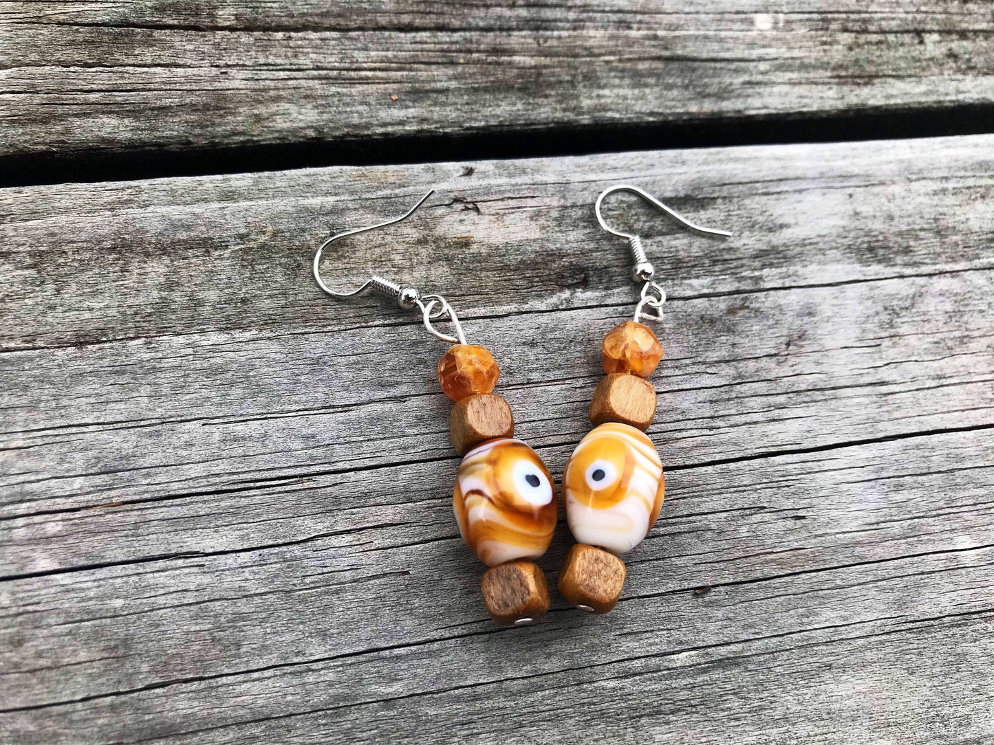 Trippy eye dangle earrings with glass and wood beads