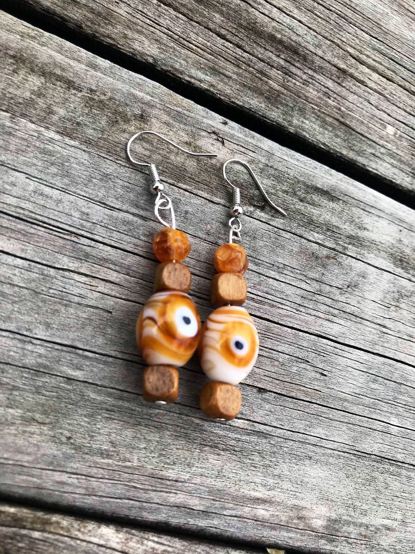 Trippy eye dangle earrings with glass and wood beads